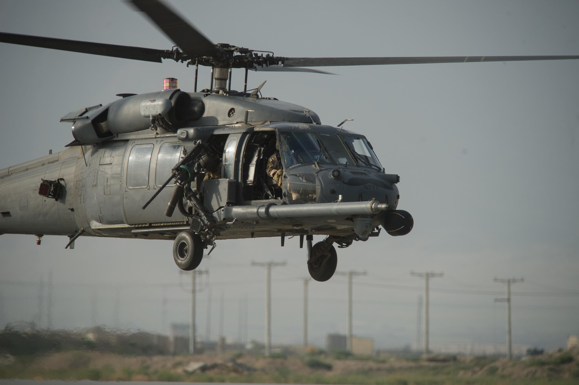 A U.S. Air Force HH-60G Pave Hawk helicopter assigned to the 83rd Expeditionary Rescue Squadron lands during Guardian Angel High Altitude Low Opening jump training at Bagram Airfield, Afghanistan, July 18, 2015. The 83rd ERQS mission is to rescue, recover, and return American or allied forces in times of danger or extreme duress. (U.S. Air Force photo by Tech. Sgt. Joseph Swafford/Released)