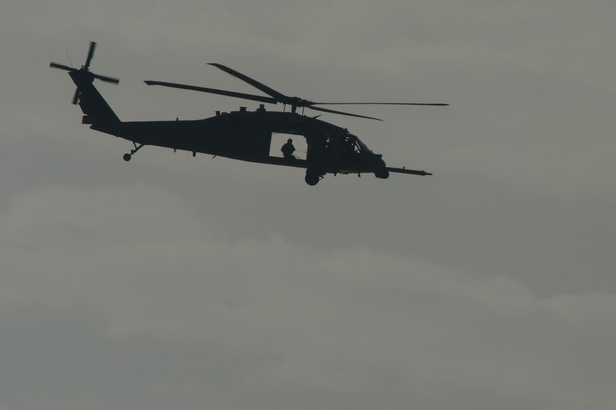 A U.S. Air Force HH-60G Pave Hawk helicopter assigned to the 83rd Expeditionary Rescue Squadron leaves the drop zone after Guardian Angel High Altitude Low Opening jump training at Bagram Airfield, Afghanistan, July 18, 2015. The 83rd ERQS mission is to rescue, recover, and return American or allied forces in times of danger or extreme duress. (U.S. Air Force photo by Tech. Sgt. Joseph Swafford/Released)