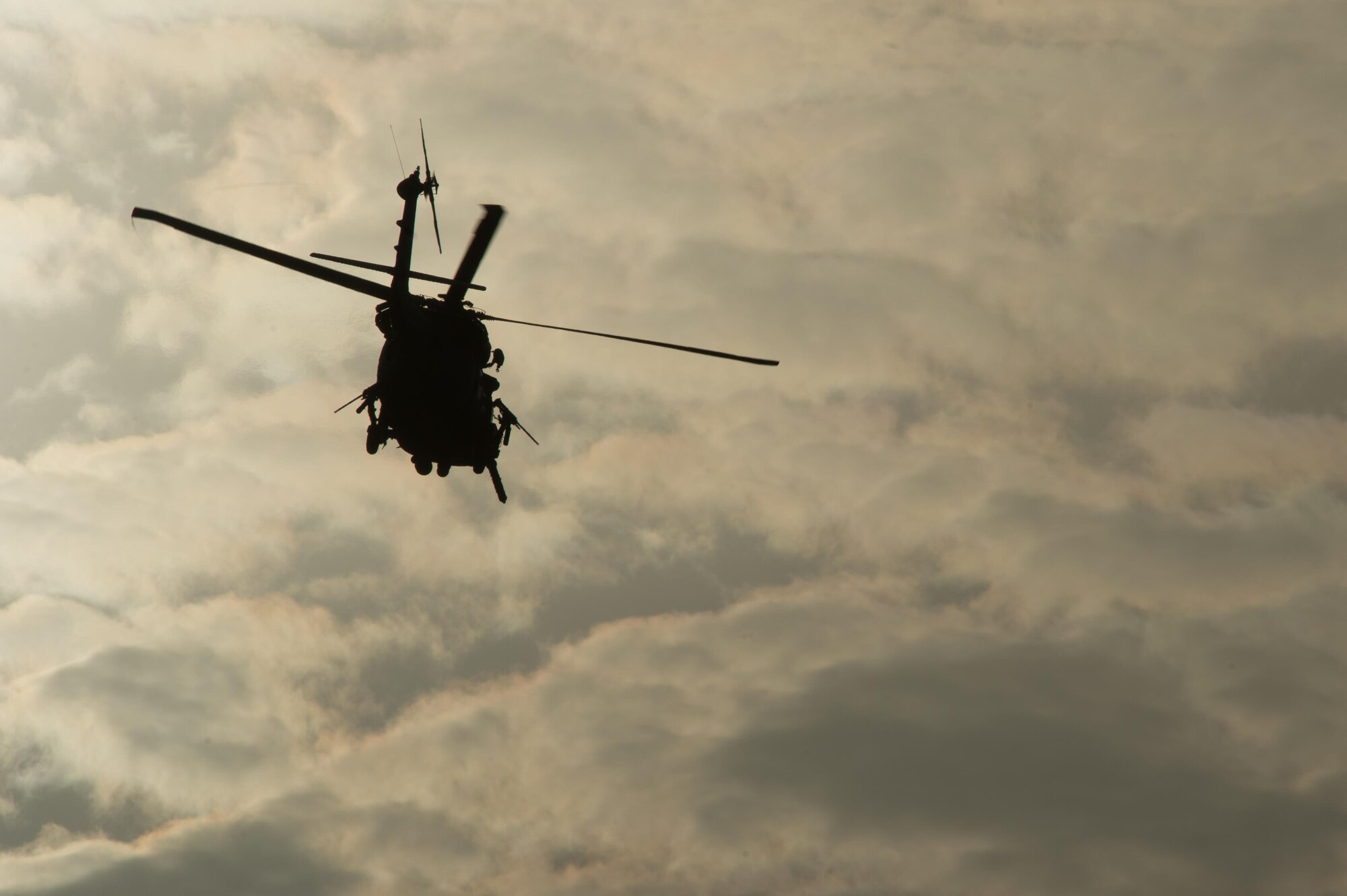 A U.S. Air Force HH-60G Pave Hawk helicopter assigned to the 83rd Expeditionary Rescue Squadron takes off during Guardian Angel High Altitude Low Opening jump training at Bagram Airfield, Afghanistan, July 18, 2015. The 83rd ERQS mission is to rescue, recover, and return American or allied forces in times of danger or extreme duress. (U.S. Air Force photo by Tech. Sgt. Joseph Swafford/Released)