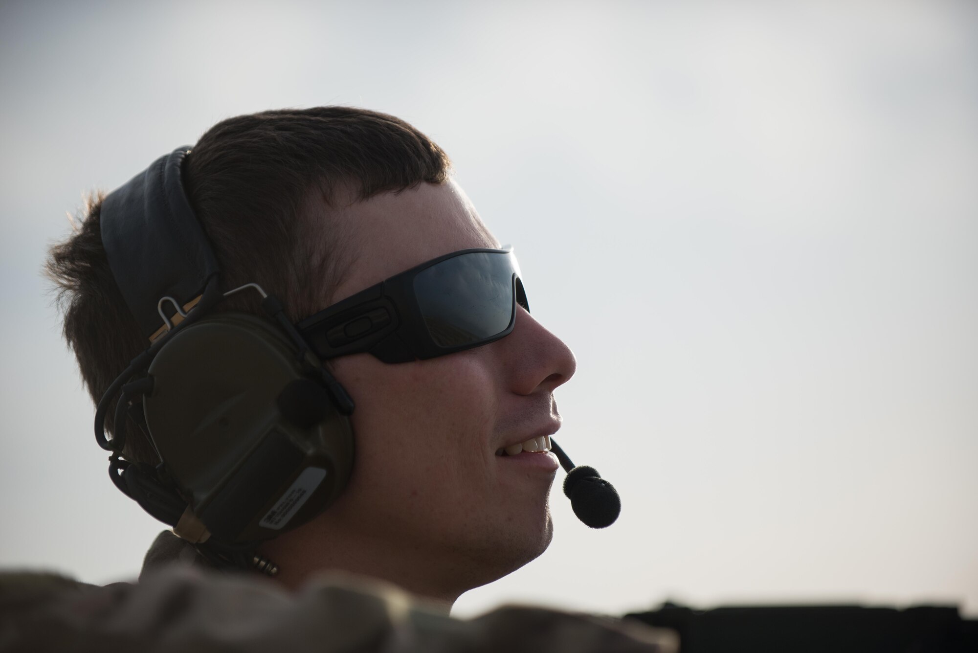 A U.S. Airman assigned to the 83rd Expeditionary Rescue Squadron communicates with the crew of a HH-60G Pave Hawk helicopter during Guardian Angel High Altitude Low Opening jump training at Bagram Airfield, Afghanistan, July 18, 2015. The 83rd ERQS mission is to rescue, recover, and return American or allied forces in times of danger or extreme duress. (U.S. Air Force photo by Tech. Sgt. Joseph Swafford/Released)