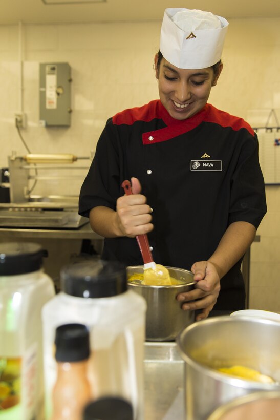 LCpl. Dalia Nava, a food-service specialist with Headquarters and Headquarters Squadron, Marine Corps Air Station, Marine Corps Installations Pacific, prepares various sauces for the snack line in Futenma Mess Hall, July 15, 2015, aboard MCAS Futenma, Okinawa, Japan. Futenma Mess Hall recently received its fifth consecutive Mess Hall of the Quarter award for overall outstanding performance throughout MCIPAC.  