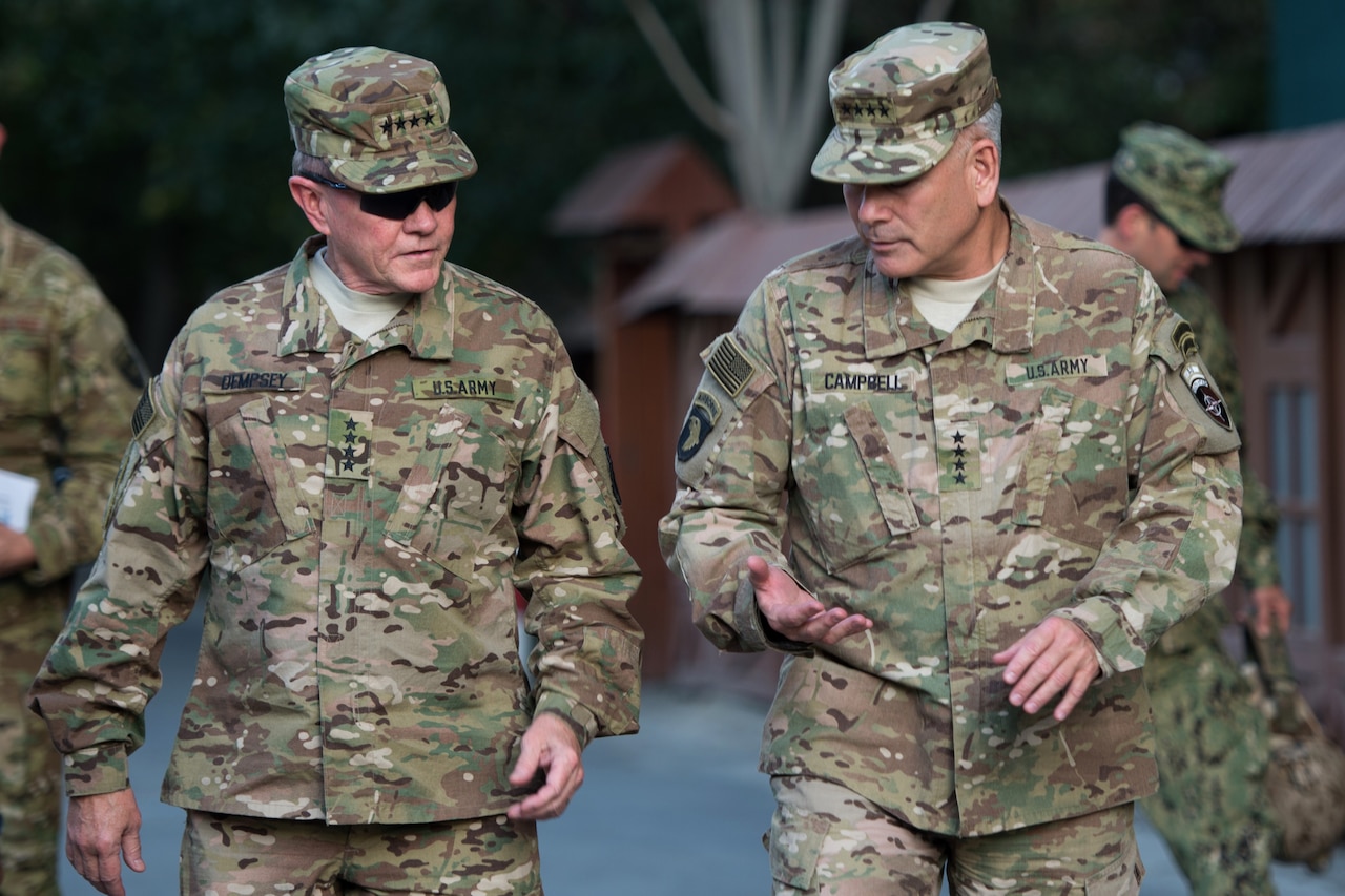 Army Gen. Martin E. Dempsey, left, chairman of the Joint Chiefs of Staff, talks with Army Gen. John F. Campbell, commander of the NATO-led Resolute Support mission, in Kabul, Afghanistan, July 19, 2015. Dempsey visited Afghanistan to meet with troops and receive an update from leaders on the mission's progress. DoD photo by Navy Petty Officer1st Class Daniel Hinton