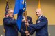 Col. Vito A. Di Micco, left, commander, 108th Mission Support Group, passes the 108th Civil Engineer Squadron guidon to Maj. Eric A. Balint during an Assumption of Command ceremony at the 108th Wing, New Jersey Air National Guard, at Joint Base McGuire-Dix-Lakehurst, N.J., July 18, 2015. The ceremony is a military tradition that represents the formal transfer of authority and responsibility for a unit from one commanding officer to another. Since Sept. 11, 2001, the 108th Wing has deployed Airmen around the globe in support of Operation's Iraqi Freedom, Noble Eagle, Enduring Freedom, New Dawn and Inherent Resolve.  (U.S. Air National Guard photo by Master Sgt. Mark C. Olsen/Released)