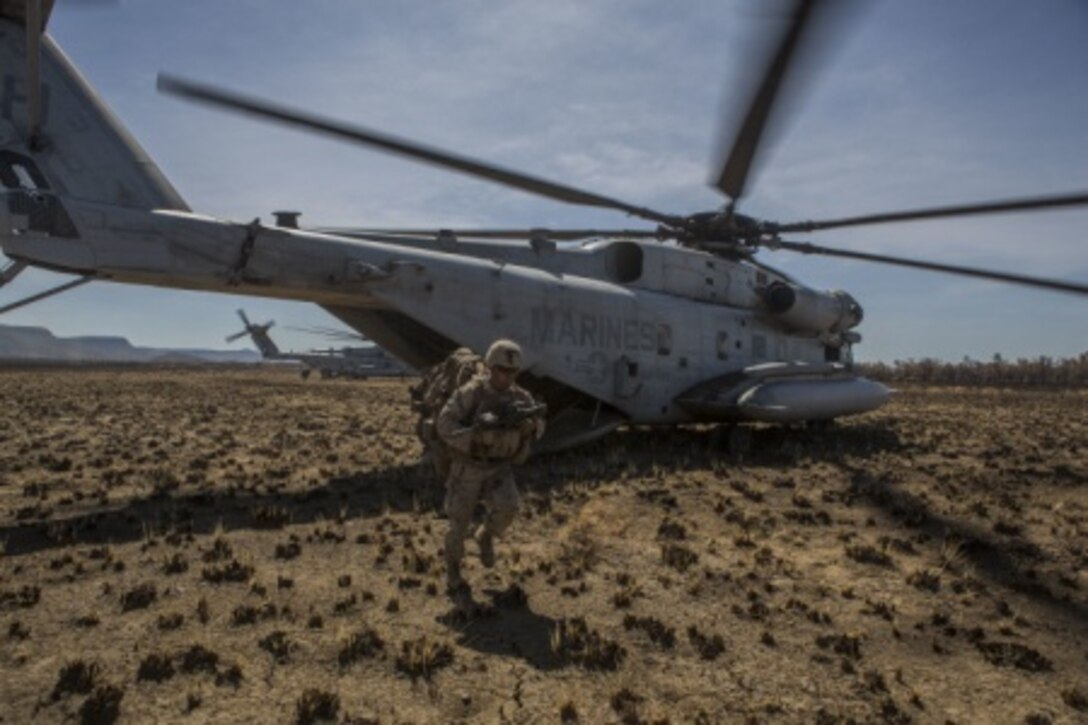 U.S. Marines with 1st Battalion, 4th Marine Regiment, exit a CH-53E Super Stallion Helicopter to prepare for a movement to contact exercise during the start of Exercise Talisman Sabre 15 on July 6, in Bradshaw, Northern Territory, Australia. Talisman Sabre is designed to improve U.S. – Australian combat readiness and interoperability, maximize combined training opportunities and conduct maritime prepositioning and logistics. The exercise allows both forces to work together and further enhance the key partnership the two nations share in their pursuit of defense in the region. 