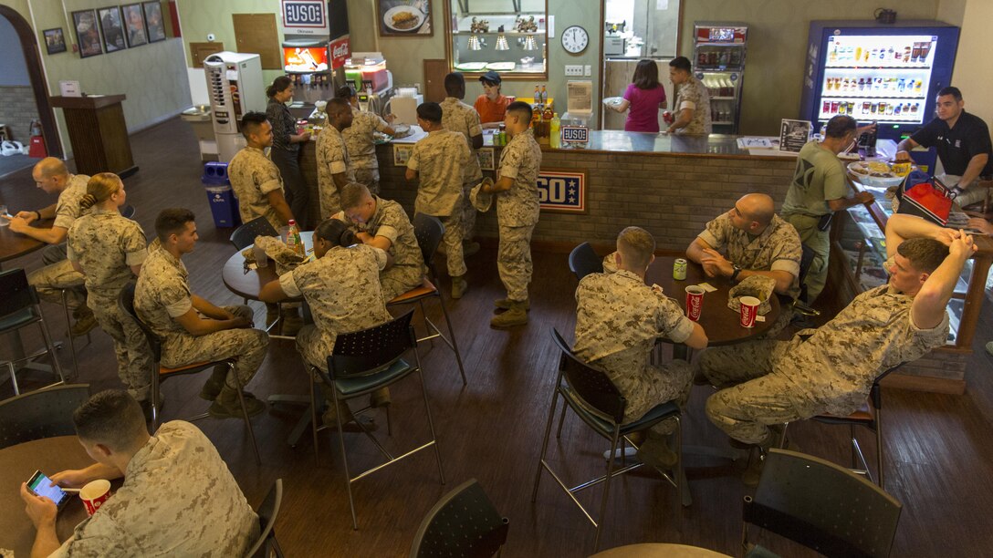 Service members and civilians enjoy services offered at United Service Organizations Futenma, Okinawa, Japan, Marine Corps Installations Pacific, to include a host of free dinners, gaming, phone calls home and movies aboard Marine Corps Air Station Futenma, July 16, 2105. The USO is a nonprofit organization that provides programs, services and live entertainment to United States service members and their families. The organization also supports to the station’s large-scale and unit events.