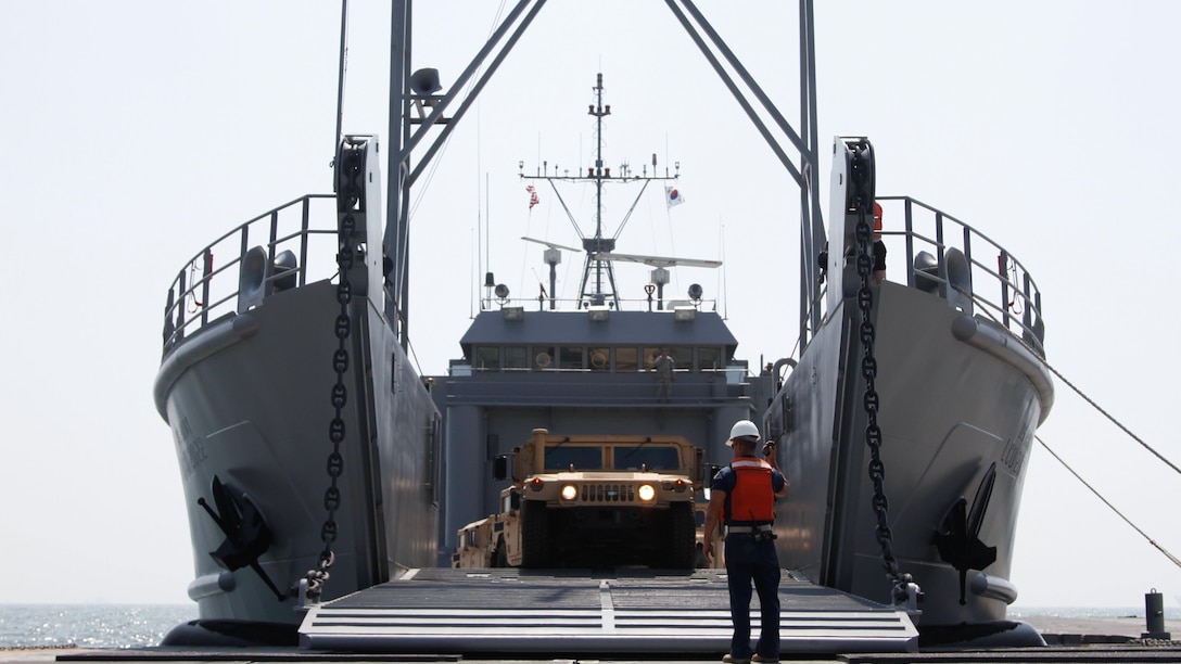The ramp on the Landing Craft Utility 2000 is lowered and unloading of vehicles begins at Anmyeon Beach, Republic of Korea. CJLOTS 2015 is an exercise designed to train U.S. and ROK service members to accomplish vital logistical measures in a strategic area while strengthening communication and cooperation in the U.S. - ROK Alliance. 