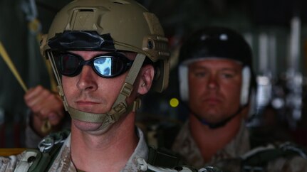 Lt. Col. George Hasseltine, the commanding officer of 1st Reconnaissance Battalion stands on the ramp of a C-130 before performing a parachute jump into the ocean at Marine Corps Base Camp Pendleton, California, July 15, 2015. The Marines and Sailors conducted low-level static-line parachute operations with intentional water landings to make insertions, where other means such as boats or high-altitude parachute jumps may not be available.