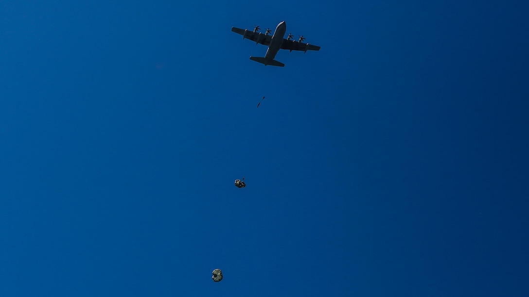 Marines assigned to Company A, 1st Marine Reconnaissance Battalion, 1st Marine Division, perform parachute jumps into the ocean at Marine Corps Base Camp Pendleton, California, July 14, 2015.  The Marines and Sailors conducted low-level static-line parachute operations with intentional water landings to make insertions, where other means such as boats or high-altitude parachute jumps may not be available.