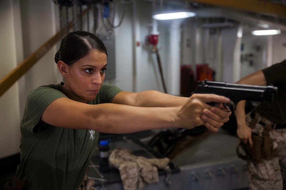 U.S. Marine Cpl Justine Woodend practices dry-fire drills with an M9 Beretta pistol aboard the amphibious assault ship USS Essex (LHD 2). Woodend is a motor transportation operator with Combat Logistics Battalion 15, 15th Marine Expeditionary Unit. Dry-fire drills help the Marines focus on the fundamentals of marksmanship. The 15th MEU is embarked on the Essex Amphibious Ready Group and deployed to maintain regional security in the U.S. 5th Fleet area of operations. 