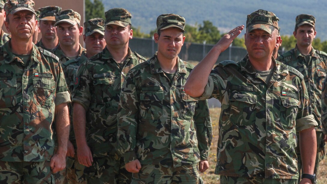 Bulgarian Army Capt. Penio Todoranov, company commander with the 61st Mechanized Brigade, salutes during the closing ceremony of Platinum Lion 15-3. Marines and Sailors with 2nd Battalion, 8th Marine Regiment, Black Sea Rotational Force spent two weeks alongside soldiers from Bulgaria, Albania, United Kingdom and Romania during the multi-national NATO training exercise at Novo Selo Training Area, Bulgaria.