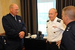 Army Gen. Martin Dempsey, the chief of staff of the Army, speaks with Air Force Gen. Craig McKinley, chief of the National Guard Bureau and Air Force Maj. Gen. Michael Dubie, Vermont National Guard adjutant general, before Dempsey spoke to National Guard senior leadership during the 2011 Adjutants General Association of the United States annual conference, June 7, 2011.
