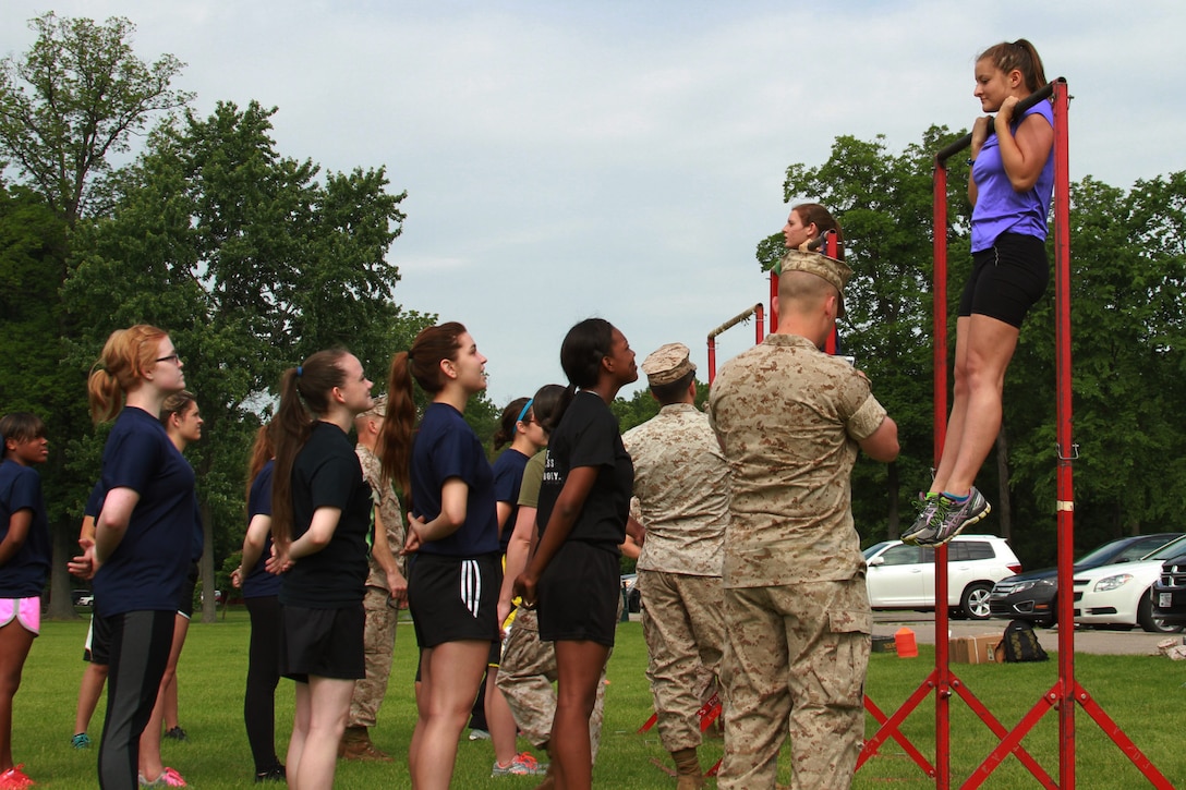 Recruiting Station Detroit’s female Marine poolees conduct the flexed-arm hang during the bi-annual female pool function at the Boys and Girls Club of Troy, Michigan, June 20, 2015. The ladies started the day off with the Initial Strength Test that includes three events: pull-ups or a flexed arm hang, crunches, and a 1.5 mile run for time. (U.S. Marine Corps photo by Cpl. J.R. Heins/Released)