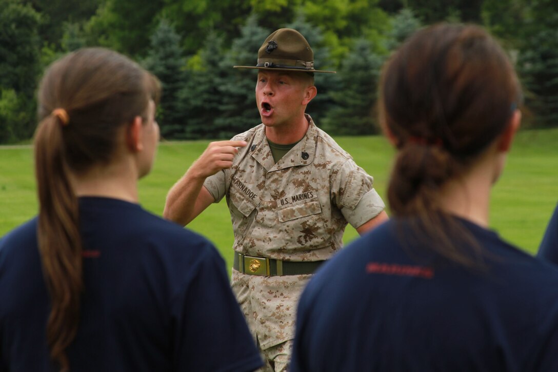 U.S. Marine Corps Staff Sgt. Jason Varnadoe, a native of Lubricity, Georgia, and drill instructor at Marine Corps Recruit Depot, Parris Island, South Carolina, introduces himself to the female poolees of Recruiting Station Detroit during the bi-annual female pool function at the Boys and Girls Club of Troy, Michigan, June 20, 2015. Varnadoe taught the ladies basic drill movements to help prepare them for the standards of recruit training.  (U.S. Marine Corps photo by Cpl. J.R. Heins/Released)