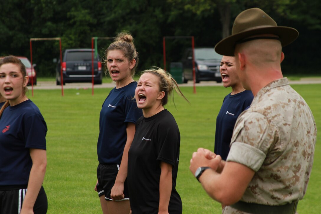 U.S. Marine Corps Staff Sgt. Jason Varnadoe, a native of Lubricity, Georgia, and drill instructor at Marine Corps Recruit Depot, Parris Island, South Carolina, instructs the female poolees of Recruiting Station Detroit during the bi-annual female pool function at the Boys and Girls Club of Troy, Michigan, June 20, 2015. Varnadoe taught the ladies basic drill movements to help prepare them for the standards of recruit training.  (U.S. Marine Corps photo by Cpl. J.R. Heins/Released)