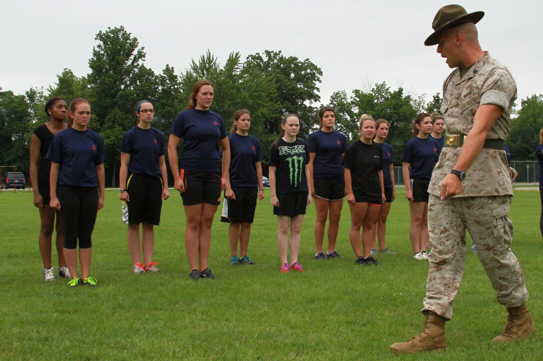 U.S. Marine Corps Staff Sgt. Jason Varnadoe, a native of Lubricity, Georgia, and drill instructor at Marine Corps Recruit Depot, Parris Island, South Carolina, instructs the female poolees of Recruiting Station Detroit during the bi-annual female pool function at the Boys and Girls Club of Troy, Michigan, June 20, 2015. Varnadoe taught the ladies basic drill movements to help prepare them for the standards of recruit training.  (U.S. Marine Corps photo by Cpl. J.R. Heins/Released)