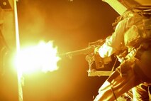U.S. Marine Sgt. Joseph Walkerstill, a Weapons and Tactics Instructor with Marine Medium Tiltrotor Squadron-165 (VMM-165), Special Purpose Marine Air-Ground Task Force—Crisis Response—Central Command, fires an M240 machine gun during Aerial Gunnery Training aboard an MV-22 in an Southwest Asia, July 15, 2015. The Marines of VMM – 165 celebrate the unit’s 50th anniversary while deployed with the SPMAGTF; providing long range assault support, troop transport and cargo delivery in the Central Command Area of Operations, as well as support to the Tactical Recovery of Aircraft and Personnel. (U.S. Marine Corps Photo by Cpl. Leah Agler)