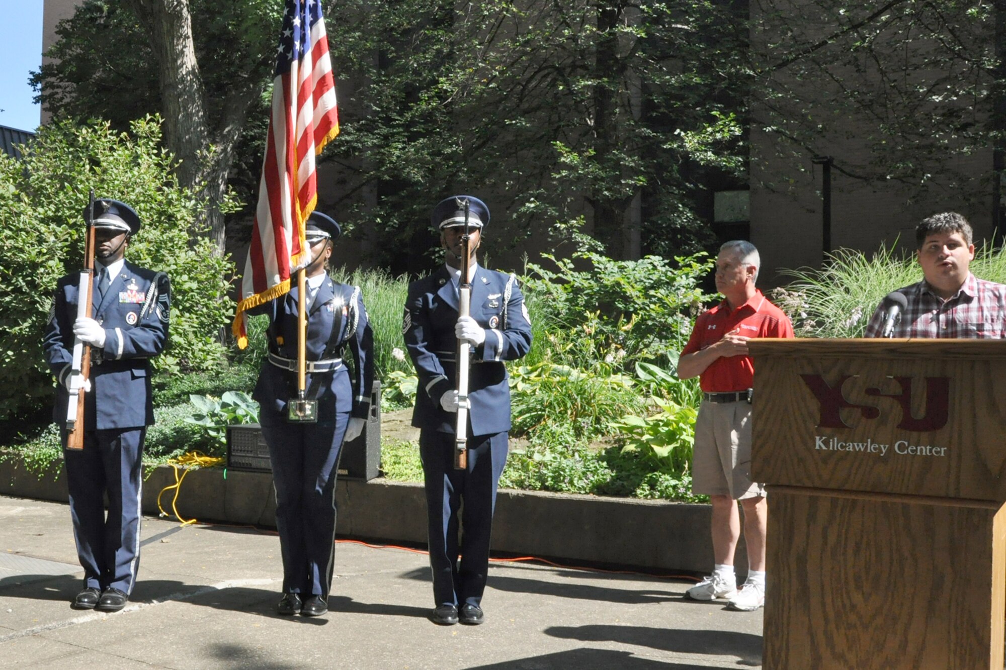 Members of the Air Force Reserve’s 910th Airlift Wing Honor Guard, based at nearby Youngstown Air Reserve Station, presents the colors during the opening ceremony of the annual Summer Festival of the Arts held on the Youngstown State University Campus here, July 11, 2015. YSU President James P. Tressel looks at the honor guard’s American flag while YSU Dana School of Music bassoon performance major Dean La Salandra sings the national anthem. The 910th Airlift Wing Honor Guard provides colors presentations, participates in parades and renders honors at military funerals as part of the 910th’s extensive community outreach efforts. (U.S. Air Force photo/Master Sgt. Bob Barko Jr.)