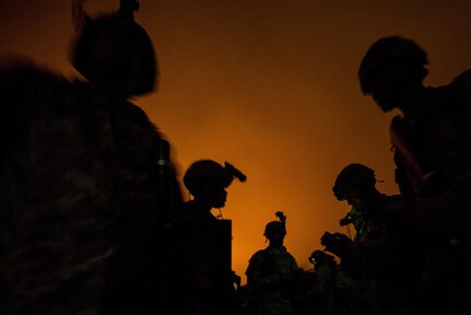 U.S. Army Reserve Combat Engineer Soldiers from the 374th Engineer Company (Sapper), headquartered in Concord, Calif., prepare for a night land navigation course at Camp San Luis Obispo Military Installation, Calif., July 15, during a two-week field exercise known as a Sapper Leader Course Prerequisite Training. The land navigation course began after dark and most Soldiers didn't finish until after midnight after trekking for miles through the steep California hills. The unit is grading its Soldiers on each event to determine which ones will earn a spot on a "merit list" to attend the Sapper Leader Course at Fort Leonard Wood, Mo. (U.S. Army photo by Master Sgt. Michel Sauret)