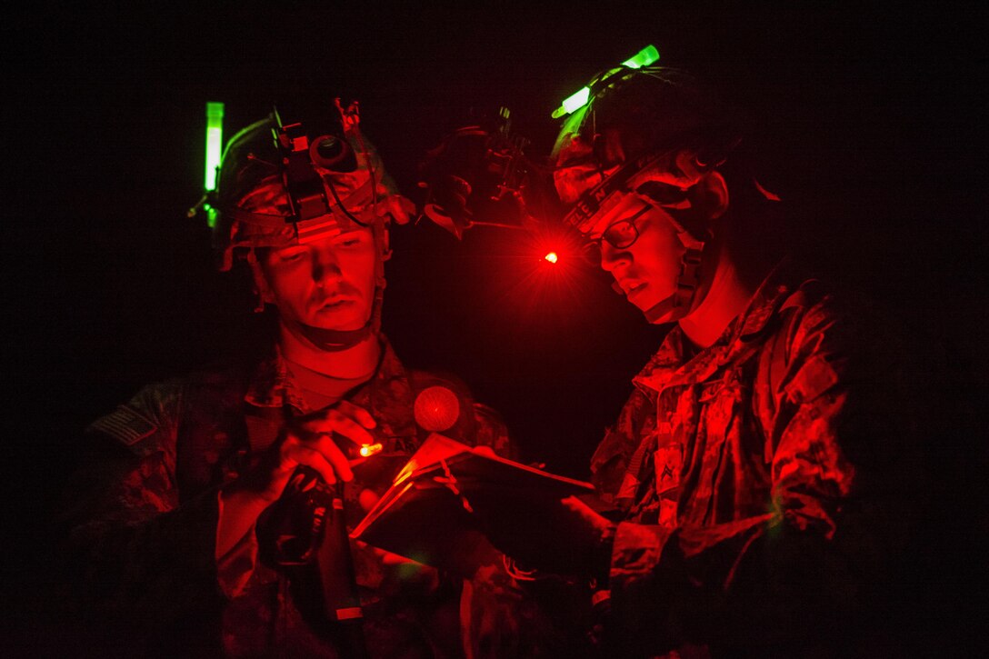 Cpl. Brock O'Shaughnessy and Cpl. James Farran, U.S. Army Reserve Combat Engineer Soldiers with the 374th Engineer Company (Sapper), headquartered in Concord, Calif., orient themselves on the map during a night land navigation course through the hills and mountains of Camp San Luis Obispo Military Installation, Calif., July 15, during a two-week field exercise known as a Sapper Leader Course Prerequisite Training. The unit is grading its Soldiers on each event to determine which ones will earn a spot on a "merit list" to attend the Sapper Leader Course at Fort Leonard Wood, Mo. (U.S. Army photo by Master Sgt. Michel Sauret)