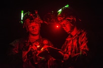 Cpl. Brock O'Shaughnessy and Cpl. James Farran, U.S. Army Reserve Combat Engineer Soldiers with the 374th Engineer Company (Sapper), headquartered in Concord, Calif., orient themselves on the map during a night land navigation course through the hills and mountains of Camp San Luis Obispo Military Installation, Calif., July 15, during a two-week field exercise known as a Sapper Leader Course Prerequisite Training. The unit is grading its Soldiers on each event to determine which ones will earn a spot on a "merit list" to attend the Sapper Leader Course at Fort Leonard Wood, Mo. (U.S. Army photo by Master Sgt. Michel Sauret)