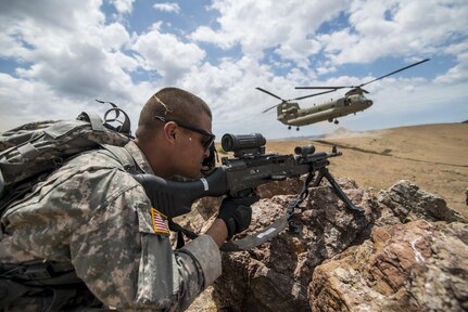 A U.S. Army Reserve combat engineer Soldier from the 374th Engineer Company (Sapper), headquartered in Concord, Calif., covers a sector of fire during an air assault landing July 18 during a two-week field training exercise known as a Sapper Leader Course Prerequisite Training at Camp San Luis Obispo Military Installation, Calif. The unit is grading its Soldiers on various events to determine which ones will earn a spot on a "merit list" to attend the Sapper Leader Course at Fort Leonard Wood, Mo. (U.S. Army photo by Master Sgt. Michel Sauret)