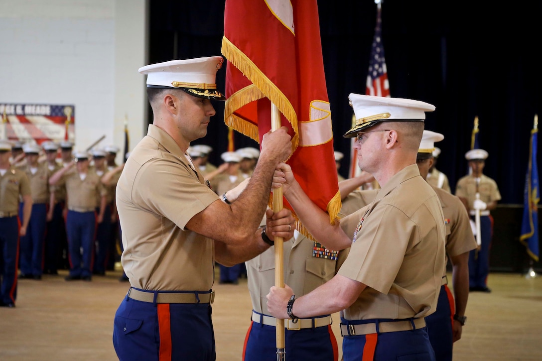 U.S. Marine Corps Maj. Christopher S. Conner, right, relinquishes command of Recruiting Station Baltimore to Maj. Jason C. Copeland during a change of command ceremony at Fort George G. Meade, Maryland, June 18, 2015. Conner, a native of Gastonia, North Carolina, served as the commanding officer of RS Baltimore for three years during which time the Marines under his command succeeded in contracting 2,168 men and women into the Marine Corps. Copeland, a native of Roswell, New Mexico, previously served as the operations officer for 2nd Battalion, 5th Marine Regiment, before being selected as the commanding officer of RS Baltimore.  (U.S. Marine Corps photo by Cpl. Tyler Birky/Released)