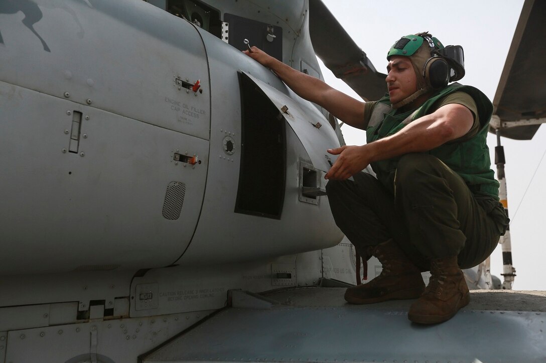 U.S. Marine Lance Cpl. Charlie Mendoza prepares to replace a hydraulic line on an AH-1Z Viper from the “Greyhawks” of Marine Medium Tiltrotor Squadron 161 (Reinforced), 15th Marine Expeditionary Unit, on the flight deck of the amphibious transport dock ship USS Anchorage (LPD 23). Mendoza is an airframes mechanic with VMM-161 (Rein.), 15th MEU. The “Greyhawks” are the aviation combat element of the 15th MEU, and embarked aboard the ships of the Essex Amphibious Ready Group, are deployed in support of maritime security operations and theater security cooperation efforts in the U.S. 5th Fleet area of operations. (U.S. Marine Corps photo by Sgt. Steve H. Lopez/Released)