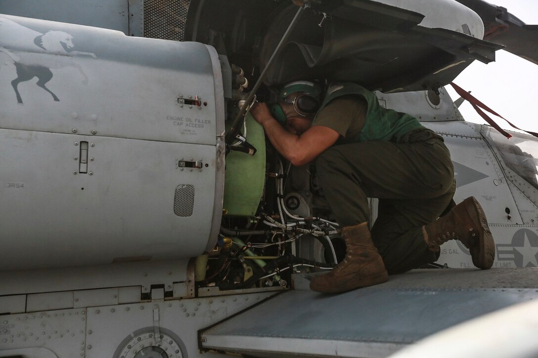 U.S. Marine Lance Cpl. Charlie Mendoza replaces a hydraulic line on an AH-1Z Viper from the “Greyhawks” of Marine Medium Tiltrotor Squadron 161 (Reinforced), 15th Marine Expeditionary Unit, on the flight deck of the amphibious transport dock ship USS Anchorage (LPD 23). Mendoza is an airframes mechanic with VMM-161 (Rein.), 15th MEU. The “Greyhawks” are the aviation combat element of the 15th MEU, and embarked aboard the ships of the Essex Amphibious Ready Group, are deployed in support of maritime security operations and theater security cooperation efforts in the U.S. 5th Fleet area of operations. (U.S. Marine Corps photo by Sgt. Steve H. Lopez/Released)