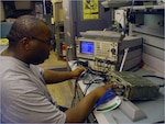 Army Sgt. Gerard Chappell, a radio and communications repair specialist with
the 1729th Forward Support Maintenance Company, 749th Combat Support
Sustainment Battalion, 4th Sustainment Brigade, 310th Expeditionary
Sustainment Command, runs a diagnostic test on a radio system at Contingency
Operating Base Adder, Iraq, May 22, 2011.