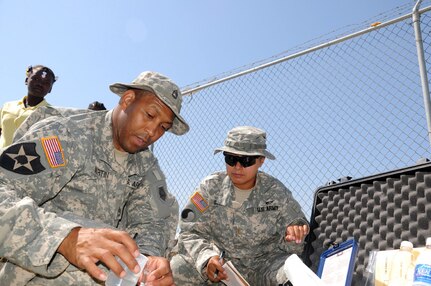 Army Sgt. 1st Class Stanley Martin, senior enlisted leader of the 125th Reverse Osmosis Water Purification Unit, and Army 2nd Lt. Danielle Golden, the 125th’s mission commander in Haiti, test the well water for impurities at a school in Gonaives, Haiti, May 16, 2011. Task Force Bon Voizen, New Horizons Haiti 2011, is a U.S. Southern Command sponsored, U.S. Army South conducted, joint foreign military interaction/humanitarian exercise under the command of the Louisiana National Guard. Task Force Bon Voizen is deploying U.S. military engineers and medical professionals to Haiti for training and to provide humanitarian services.