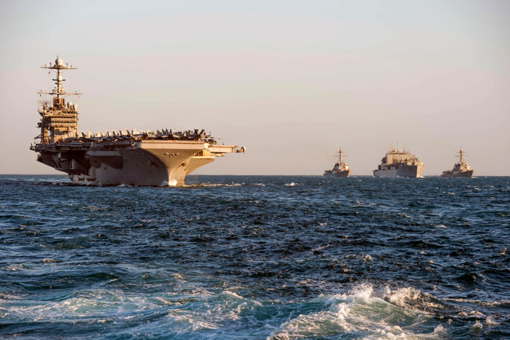 TIMOR SEA (July 19, 2015) - (from left to right) Nimitz-class aircraft carrier USS George Washington (CVN 73), Arleigh Burke-class guided-missile destroyer USS Mustin (DDG 89), dry cargo ship USNS Washington Chambers (T-AKE 11), and Arleigh Burke-class guided-missile destroyer USS Chafee (DDG 90) conduct a replenishment at sea. 