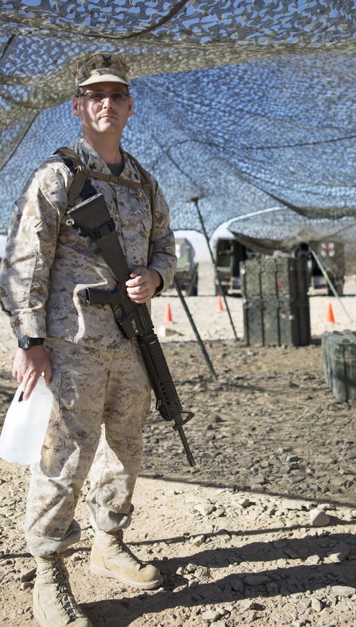 Petty Officer 2nd Class Michael J. Pornovets, religious program specialist with Company A, 4th Medical Battalion, 4th Marine Logistics Group, stands outside a medical tent at Range 400 during Integrated Training Exercise 4-15 aboard Marine Air Ground Combat Center Twentynine Palms, Calif., June 16, 2015. Pornovets opened a kayaking store called Everything Kayak after he left active duty service in the U.S. Navy. (U.S. Marine Corps photo by Cpl. Ian Leones/Released)