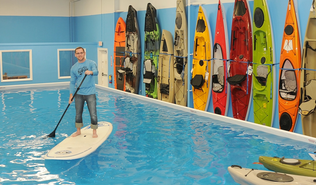 Michael J. Pornovets paddles through a pool at his store, Everything Kayak, in Gulfport, Miss. Pornovets, a petty officer 2nd class and religious program specialist with Company A, 4th Medical Battalion, 4th Marine Logistics Group, opened Everything Kayak after he left active duty service in the Navy. (Courtesy photo)