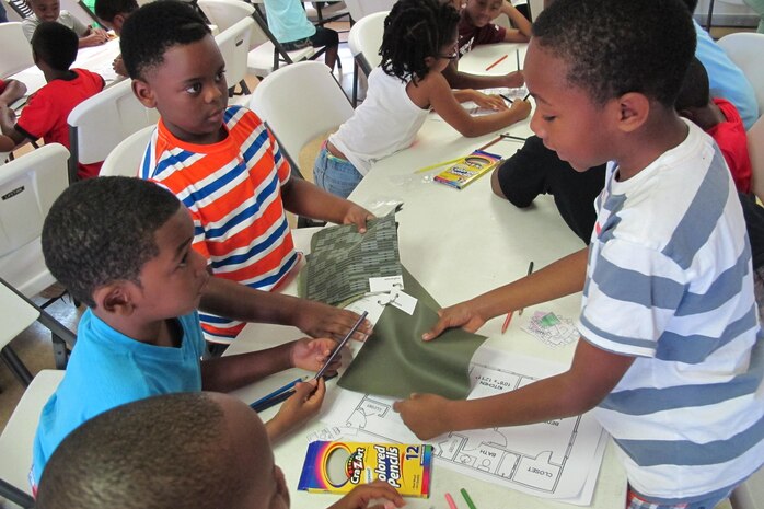 Indian Creek students experiment with color swatches during interior design activity June 19.