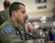 A Royal Australian Air Force space operations officer reviews exercise information at the 613th Air Operations Center at Joint Base Pearl Harbor-Hickam, Hawaii, as part of Exercise Talisman Sabre 15, July 16, 2015. Talisman Sabre is a biennial exercise that provides an invaluable opportunity for nearly 30,000 U.S. and Australian defense forces to conduct operations in a combined, joint and interagency environment that will increase both countries’ ability to plan and execute a full range of operations from combat missions to humanitarian assistance efforts. (U.S. Air Force photo by Capt. Raymond Geoffroy/Released)