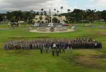 Joint U.S. service members and Royal Australia Air Force personnel pose for a photograph at the close of Talisman Sabre, July 17, 2015, at Joint Base Pearl Harbor-Hickam, Hawaii. Talisman Sabre is a biennial exercise that provides an invaluable opportunity for nearly 30,000 U.S. and Australian defense forces to conduct operations in a combined, joint and interagency environment that will increase both countries’ ability to plan and execute a full range of operations from combat missions to humanitarian assistance efforts. (U.S. Air Force photo by Master Sgt. Matthew Mc Govern/Released)