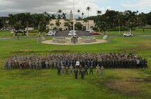Joint U.S. service members and Royal Australia Air Force personnel pose for a photograph at the close of Talisman Sabre, July 17, 2015, at Joint Base Pearl Harbor-Hickam, Hawaii. Talisman Sabre is a biennial exercise that provides an invaluable opportunity for nearly 30,000 U.S. and Australian defense forces to conduct operations in a combined, joint and interagency environment that will increase both countries’ ability to plan and execute a full range of operations from combat missions to humanitarian assistance efforts. (U.S. Air Force photo by Master Sgt. Matthew Mc Govern/Released)