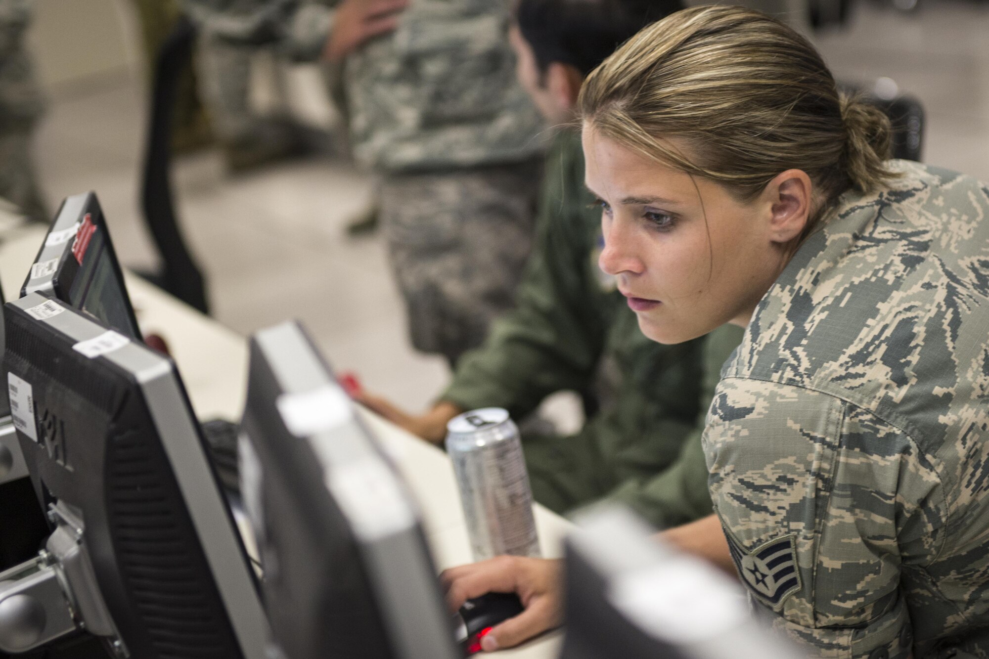 U.S. Air Force Staff Sgt. Katie Langerman, a personnel recovery Airman from Joint Base Elmendorf-Richardson, Alaska, reviews exercise information at the 613th Air Operations Center at Joint Base Pearl Harbor-Hickam, Hawaii, as part of Exercise Talisman Sabre 15, July 16, 2015. Talisman Sabre is a biennial exercise that provides an invaluable opportunity for nearly 30,000 U.S. and Australian defense forces to conduct operations in a combined, joint and interagency environment that will increase both countries’ ability to plan and execute a full range of operations from combat missions to humanitarian assistance efforts. (U.S. Air Force photo by Capt. Raymond Geoffroy/Released)