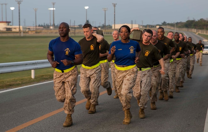 Staff non-commissioned officers attending the Advanced Career Course run in formation during physical training at Camp Hansen, Japan, March 31, 2015. The advanced course is mandatory for all gunnery sergeants to attend in order to be promoted to the next rank. The course teaches war fighting, leadership skills and unit readiness training. The SNCO’s are from various units of III Marine Expeditionary Force. (U.S. Marine Corps photo by Cpl. Devon Tindle/Released)