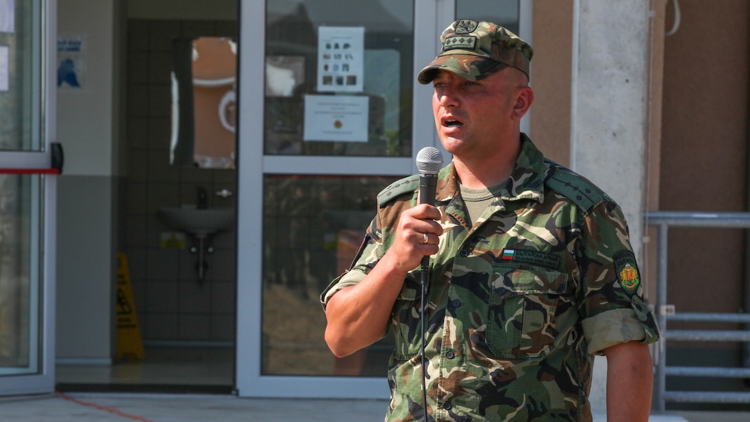 Bulgarian Army Capt. Penio Todoranov, company commander with the 61st Mechanized Brigade, speaks during the closing ceremony of Platinum Lion 15-3. Marines and Sailors with 2nd Battalion, 8th Marine Regiment, Black Sea Rotational Force spent two weeks alongside soldiers from Bulgaria, Albania, United Kingdom and Romania during the multi-national NATO training exercise at Novo Selo Training Area, Bulgaria.