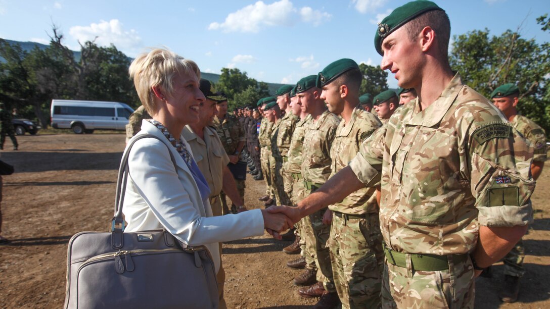 The United Kingdom’s Ambassador to Bulgaria, Emma Hopkins, greets U.K. Royal Marines from Charlie Company, 40 Commando, during Distinguished Visitors Day at Platinum Lion 15-3. Marines and Sailors with 2nd Battalion, 8th Marine Regiment, Black Sea Rotational Force spent two weeks alongside soldiers from Bulgaria, Albania, United Kingdom and Romania during the multi-national NATO training exercise at Novo Selo Training Area, Bulgaria.