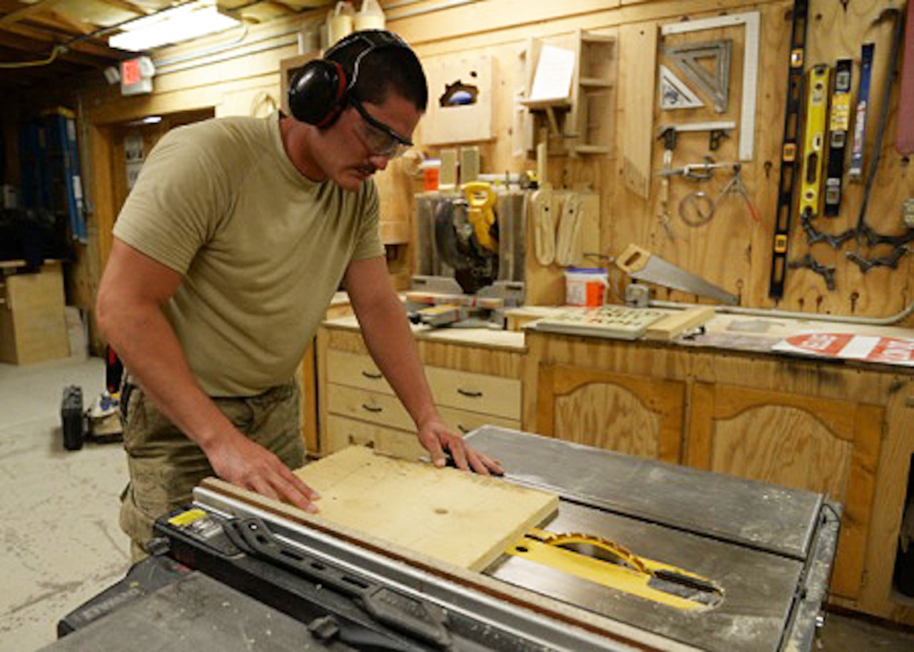 U.S. Air Force Senior Airman Carl Vanlandingham, 455th Expeditionary Civil Engineer Squadron structural journeyman, works on a project at Bagram Air Field, Afghanistan, July 16, 2015. Vanlandingham builds various projects during duty and on his days off to support the mission. U.S. Air Force photo by Senior Airman Cierra Presentado