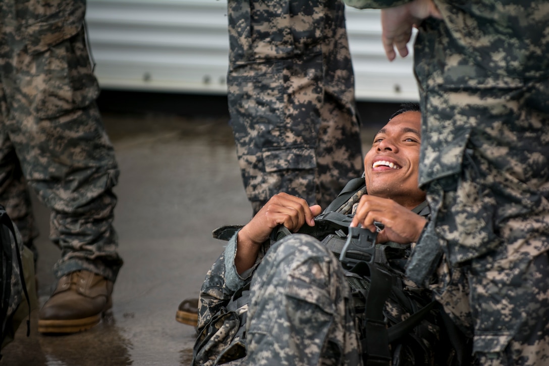 Army Reservist Cpl. Reynaldo Sanchez smiles after completing the combat water survival training at Fort Hunter Liggett, Calif., July 17, 2015. Sanchez is a combat engineer assigned to the 374th Engineer Company.