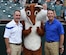 Col. Bradley Hoagland, Joint Base Andrews/11th Wing commander, and Chief Master Sgt. Vance Kondon, 11th WG command chief, pose for a photo with the 89th Airlift Wing mascot, SAMFOX, at the Bowie Baysox baseball game at Bowie, Md., Friday, July 17, 2015. Military members were invited to participate in pre-game events in honor of military appreciation night. (U.S. Air Force Photo/Senior Airman Joshua R. M. Dewberry)