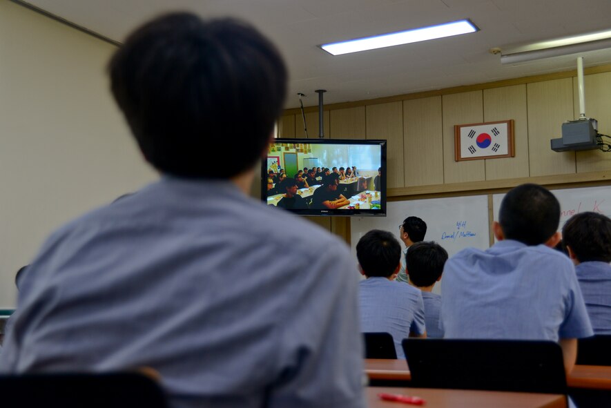 Students from the Cheonan Boys’ High School watch a video from students at Warren Academy, McMinnville, Tenn. in Cheonan, South Korea, July 10, 2015. The international cultural exchange between the schools was coordinated by Staff Sgt. Thomas Wilson, 51st Fighter Wing command post emergency actions controller, whose mother teaches at Warren Academy. The exchange allowed the students from Cheonan to not only try American snacks, but to meet Airmen on a friendly and personal level in understanding the mission of the U.S. Air Force in Korea. (U.S. Air Force photo/Senior Airman Kristin High)
