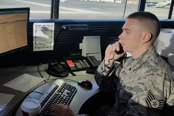 Tech. Sgt. Nathan Carlson, 62nd Aerial Port Squadron senior information controller, answers a call in the air terminal operations center June 25, 2015, at Joint Base Lewis-McChord, Wash. Carlson won the 2014 Colonel Gail Halvorsen Air Force Outstanding Air Transportation Individual of the Year Award for his efforts in aerial port operations. (U.S. Air Force photo/Airman 1st Class Keoni Chavarria)