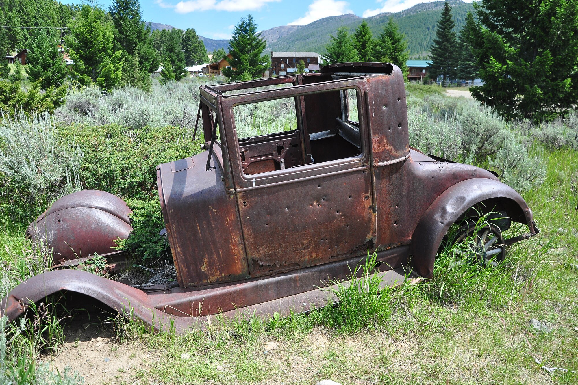 An abandoned old car sits at the outskirts of Elkhorn, a once booming mining town nestled in the Elkhorn Mountains is southwestern Montana. Visiting the town was like taking a step back in time. (U.S. Air Force photo/Tech. Sgt. Chad Thompson)