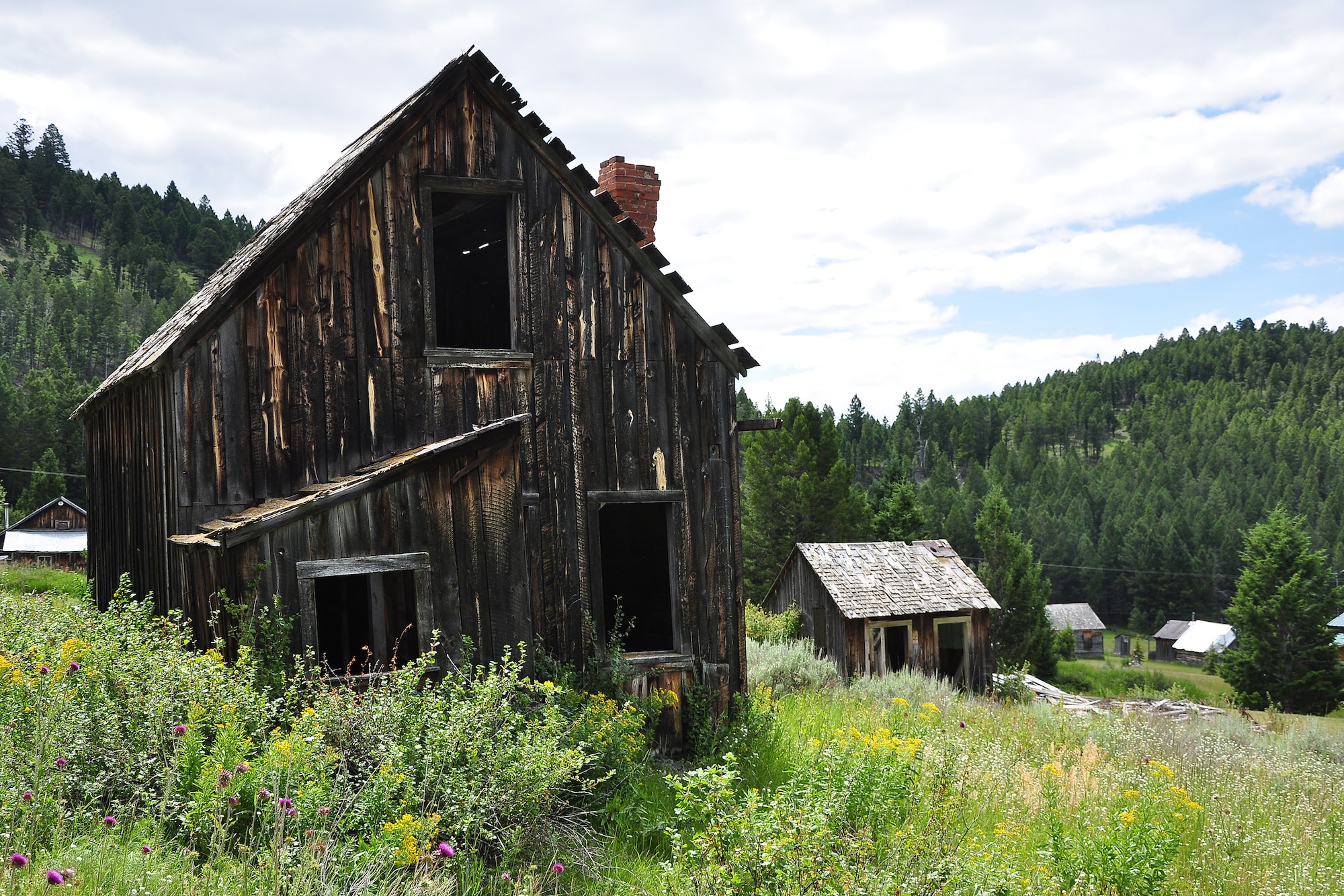 Abandoned old buildings are scattered around Elkhorn, a once booming mining town nestled in the Elkhorn Mountains is southwestern Montana. At one point during its prime, Elkhorn was producing nearly 11 tons of ore per day. The total value its mines produced is estimated at nearly $14 million in gold, silver and iron from 1880 to about 1971. (U.S. Air Force photo/Tech. Sgt. Chad Thompson)