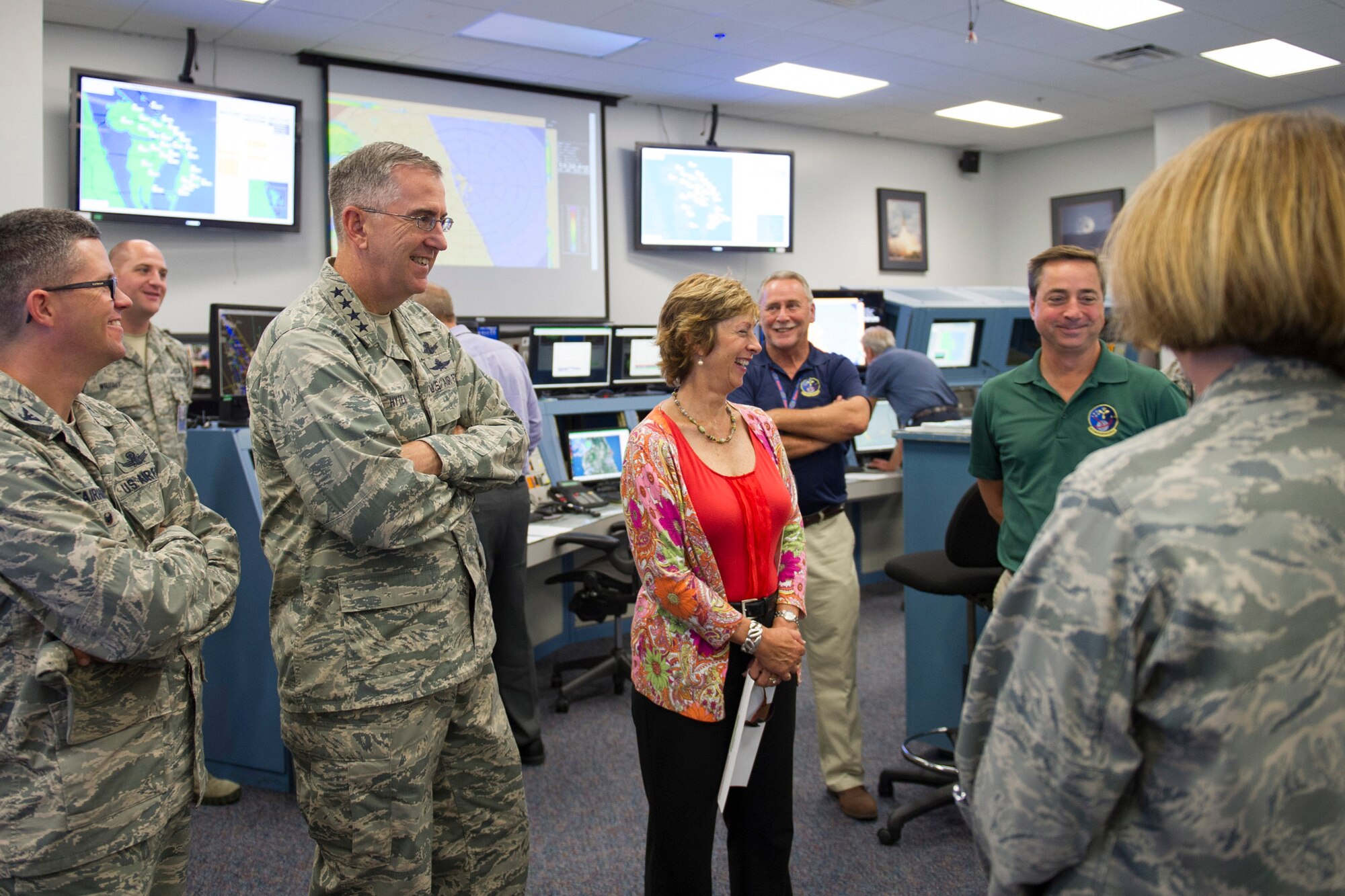 Gen. John Hyten, commander, Air Force Space Command, his wife Laura, and Col. Shawn Fairhurst, 45th Space Wing vice commander, left, speak with members of the 45th Weather Squadron about what they do during launches July 15, 2015, at the Morrell Operations Center. The 45th Space Wing hosted the general, his wife, Laura, and Chief Master Sgt. Douglas McIntyre, the AFSPC Command Chief, as the wing prepared for the launch of the Global Positioning System IIF-10. (U.S. Air Force photo/Matthew Jurgens) (Released)