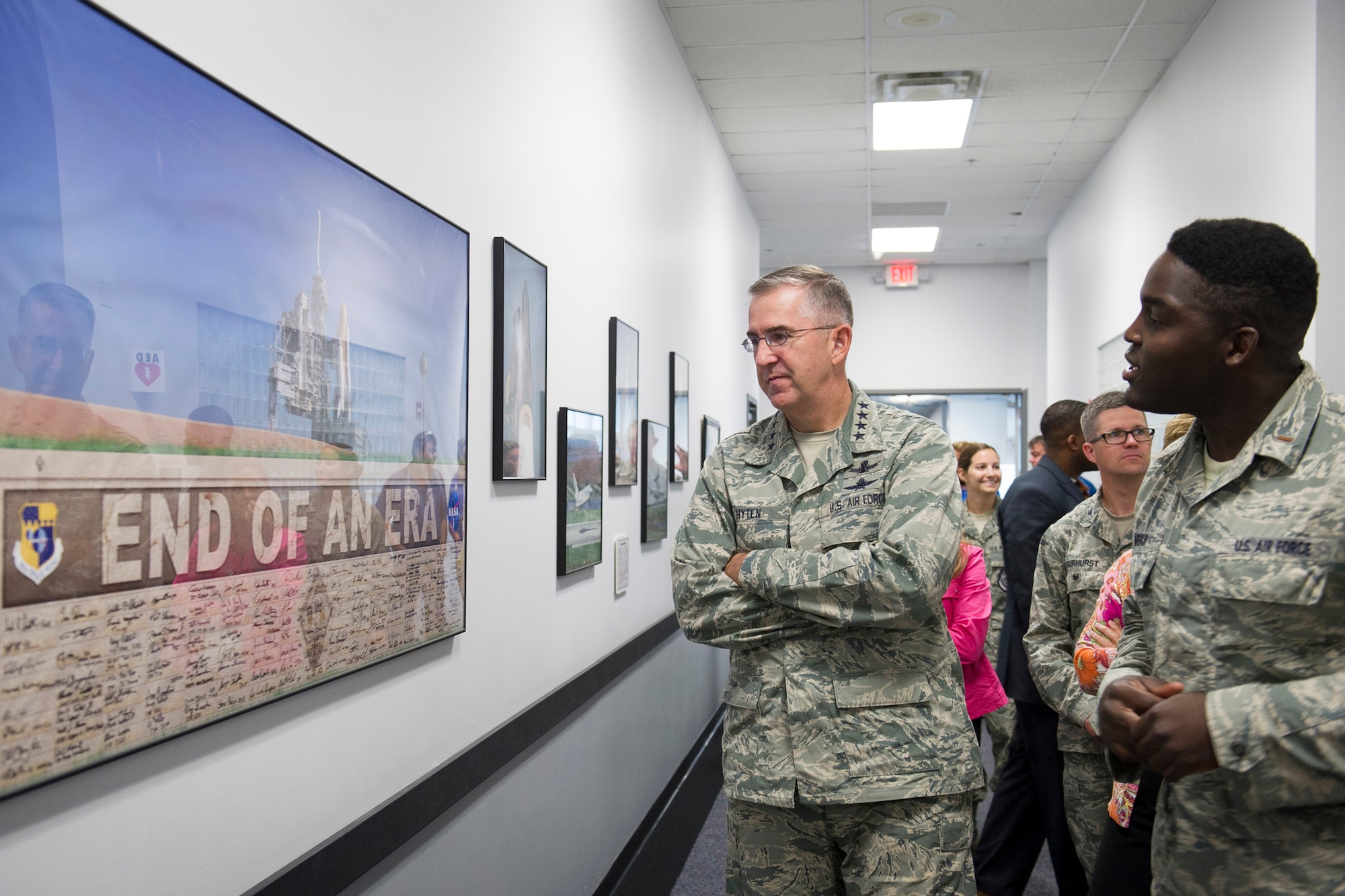 Gen. John Hyten, commander, Air Force Space Command, listens as 2nd Lt. Moshood Adeniji, 1st Range Operations Squadron, gives him a tour of the Morrell Operations Center July 15, 2015, at Cape Canaveral Air Force Station. The 45th Space Wing hosted the general, his wife, Laura, and Chief Master Sgt. Douglas McIntyre, the AFSPC Command Chief, as the wing prepared for the launch of the Global Positioning System IIF-10. (U.S. Air Force photo/Matthew Jurgens) (Released)